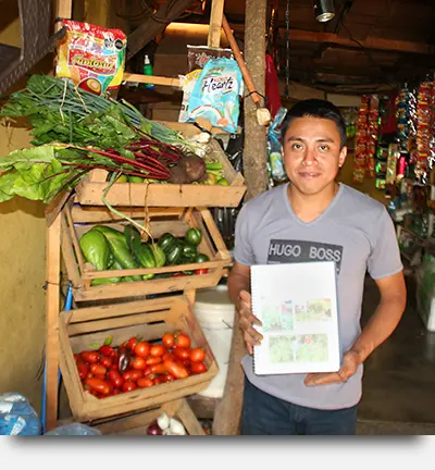 Program Participant Showcasing His Micro-business Expansion in Guatemala
