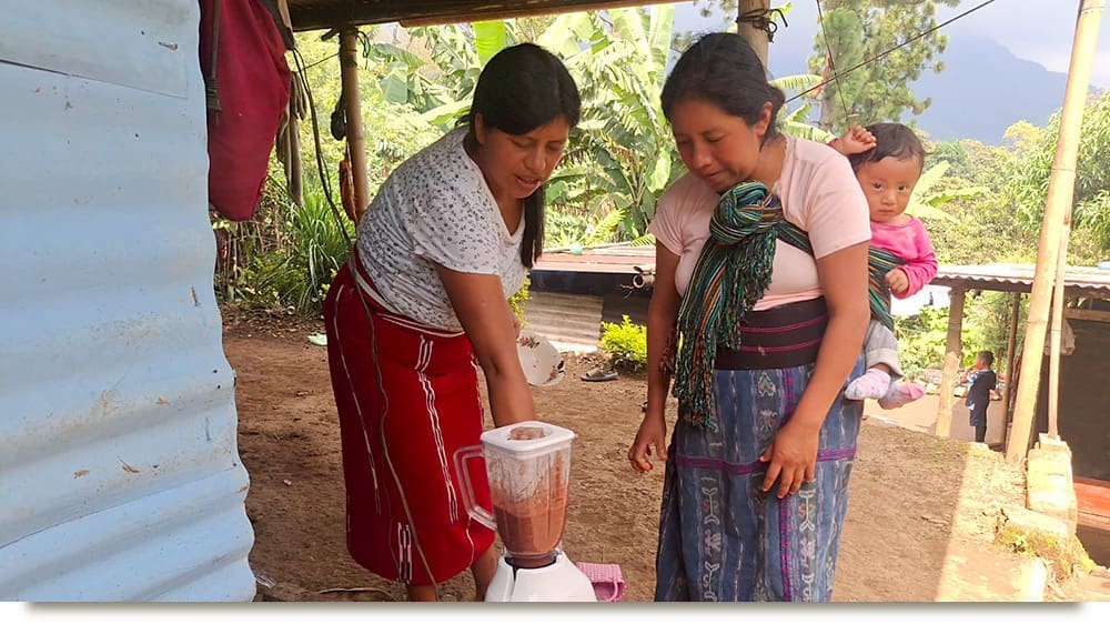 Field Team Member Explaning Food Prep for Nutrition
